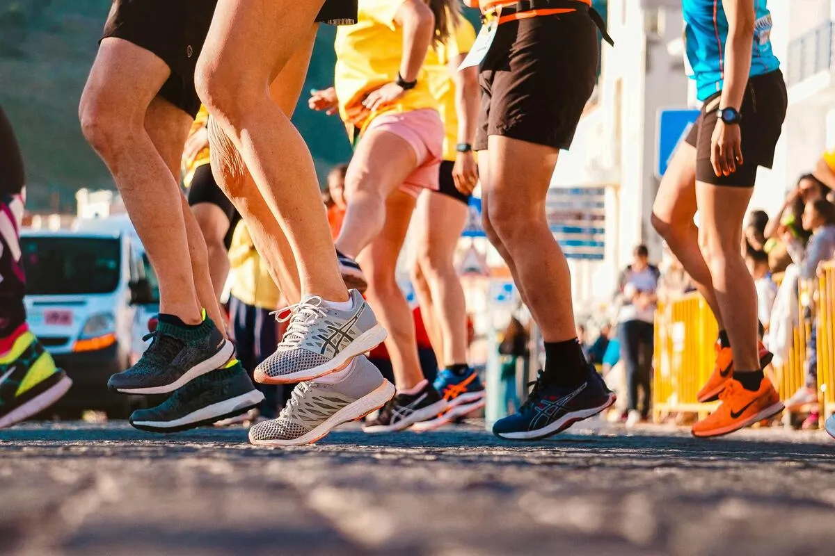 Running shoes on an athletics track at the 400m start line
